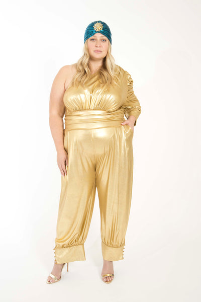 Gold one shoulder jumpsuit and blue turban