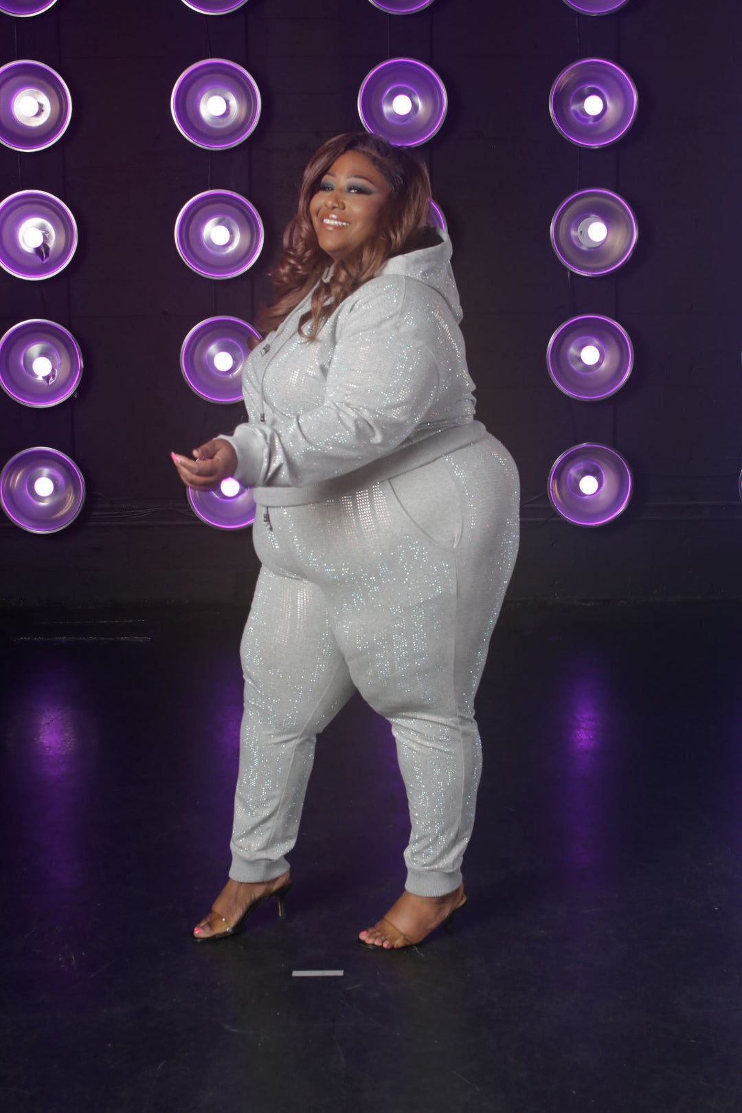 Leslie in gray mirror ball sweatsuit